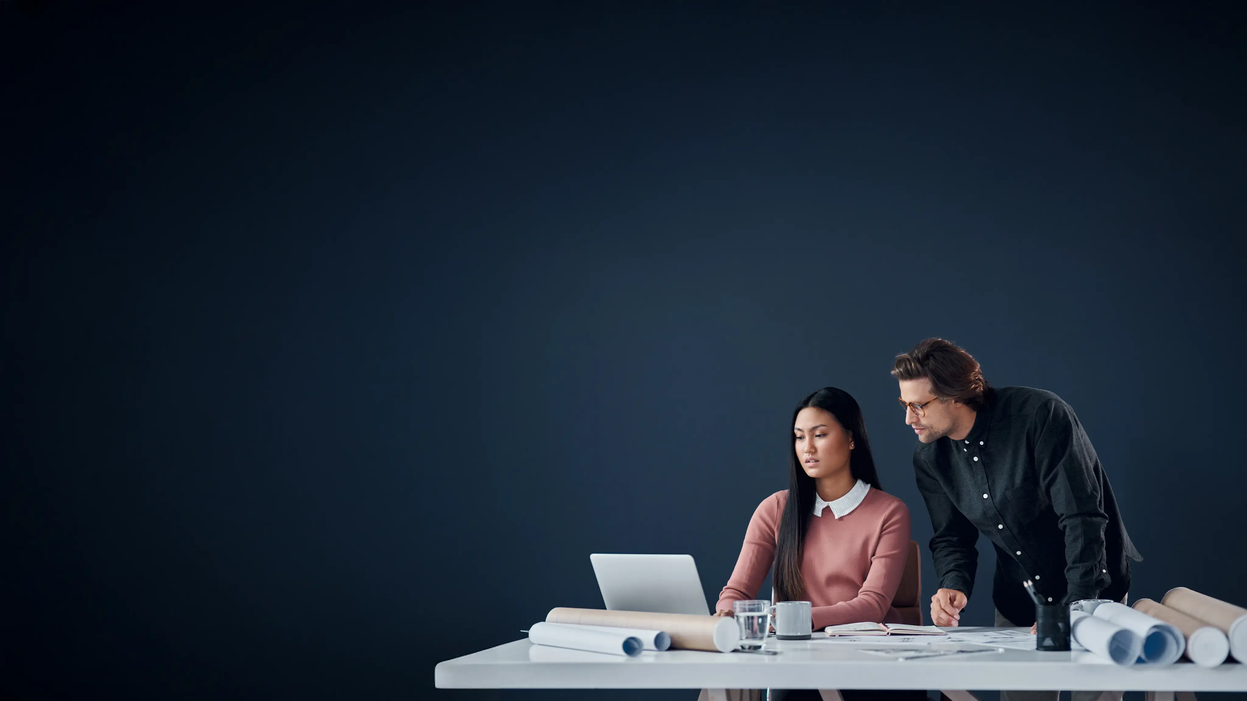 Two people working at a desk