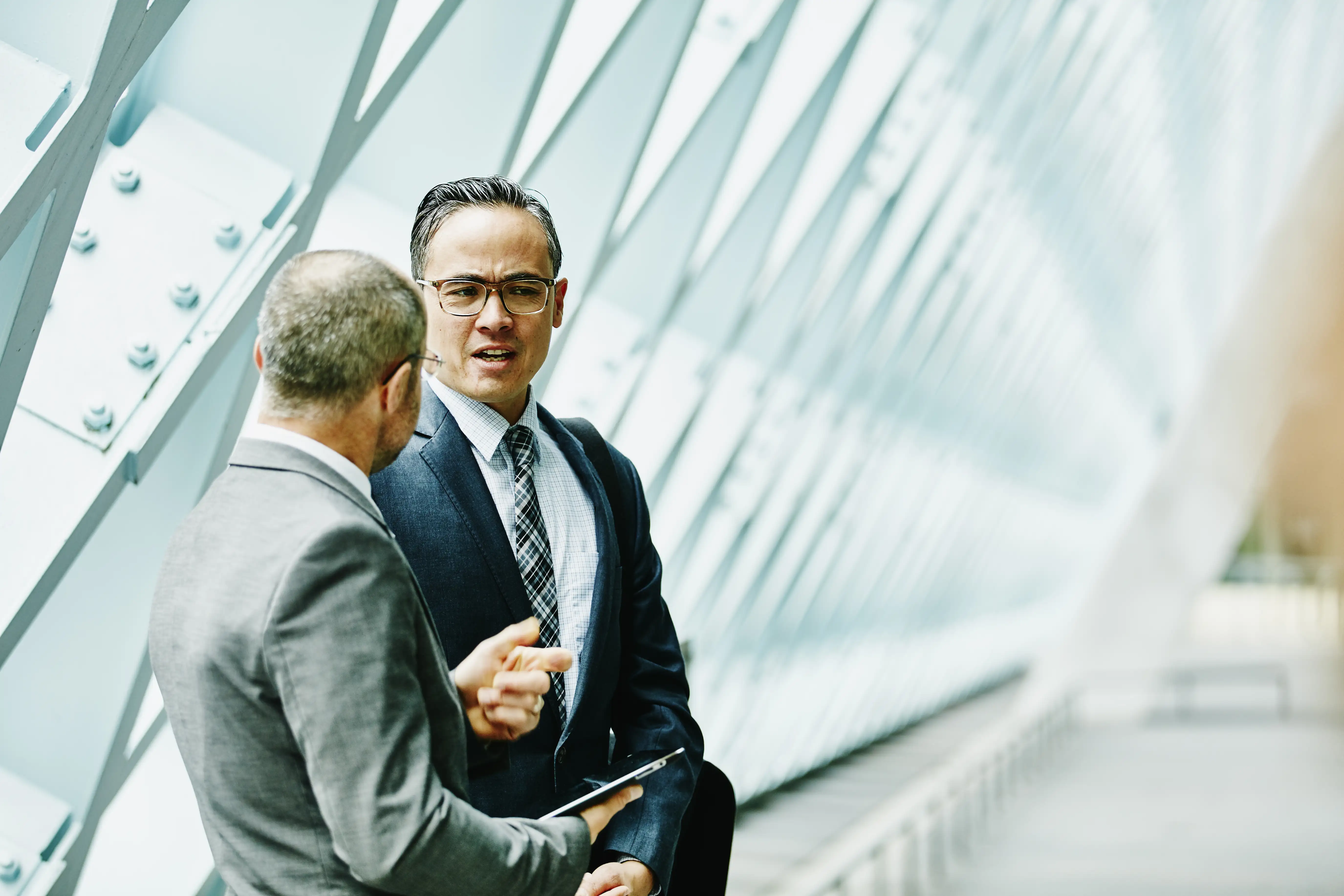 two people talking in an office building