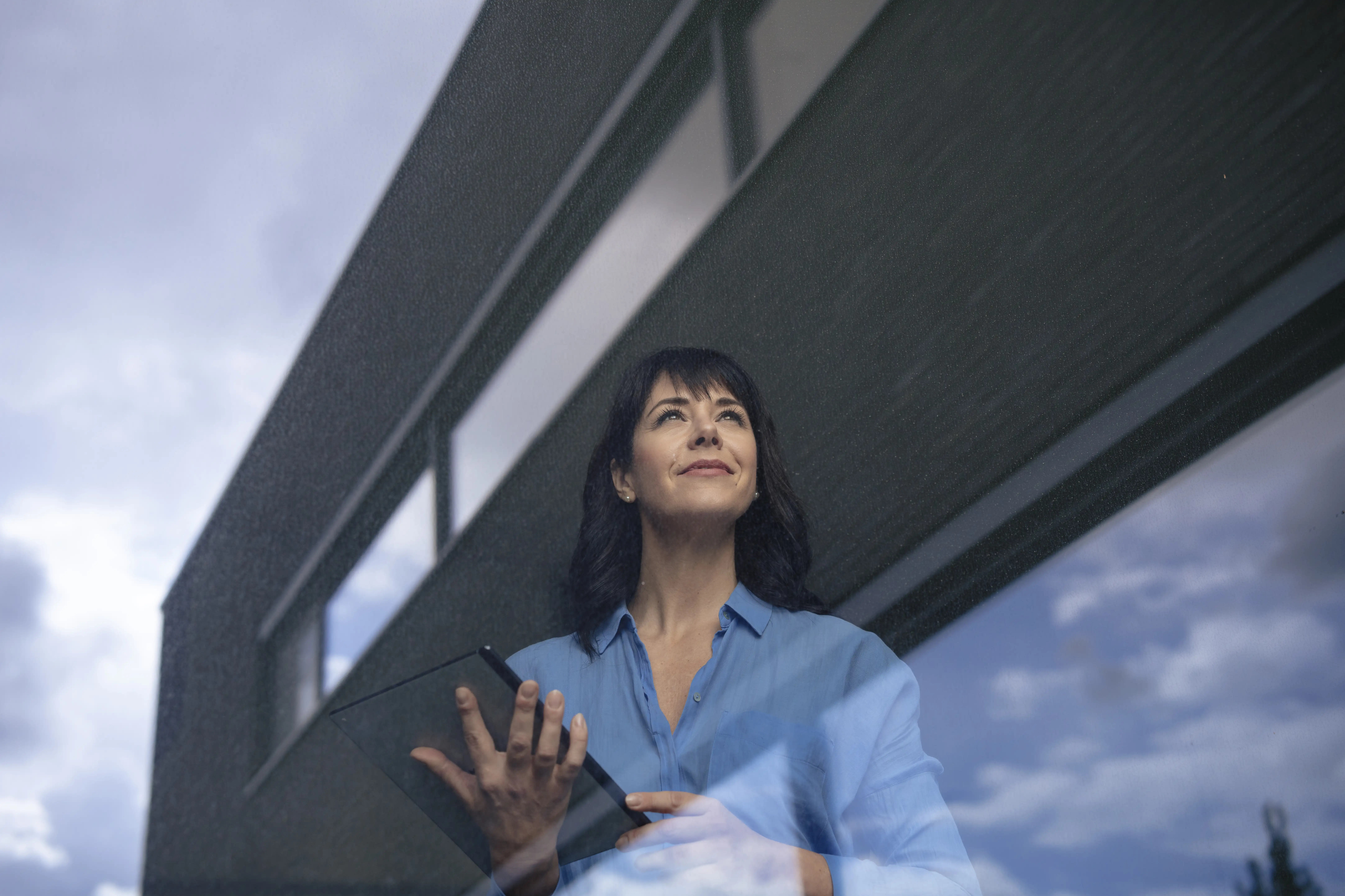 Someone holding a tablet